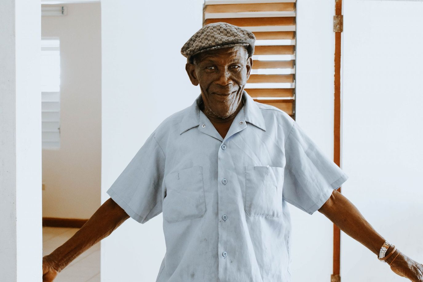 A smiling resident in a facility interior