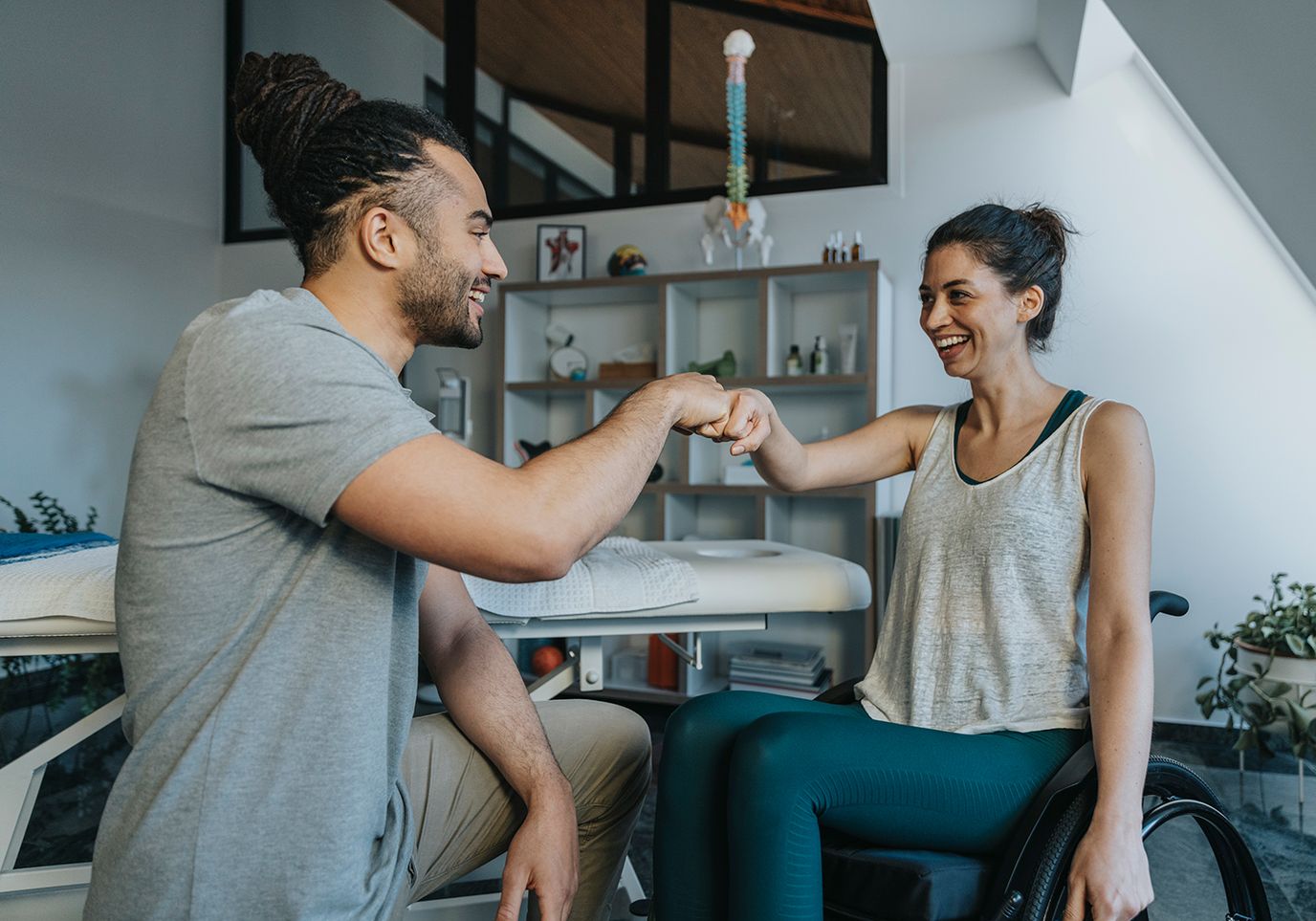 Therapist encouraging a resident in a rehabilitation session