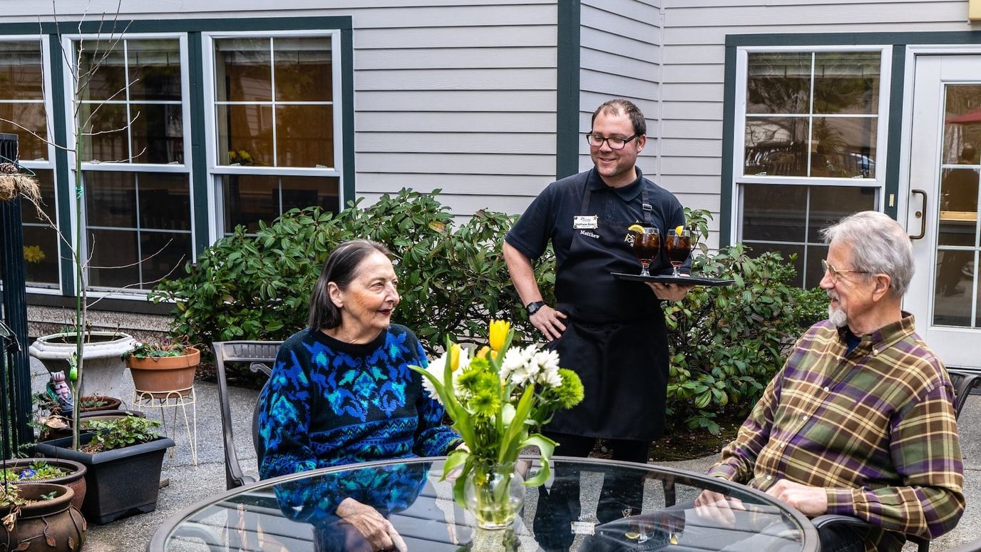 Residents enjoying conversation in an outdoor space
