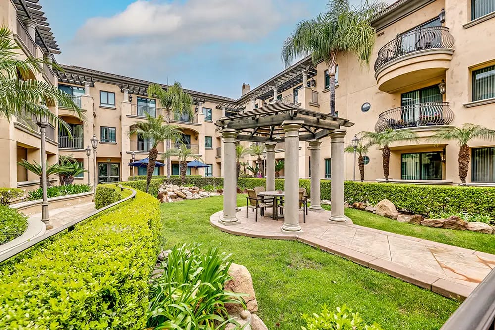 Outdoor seating area with greenery and architecture