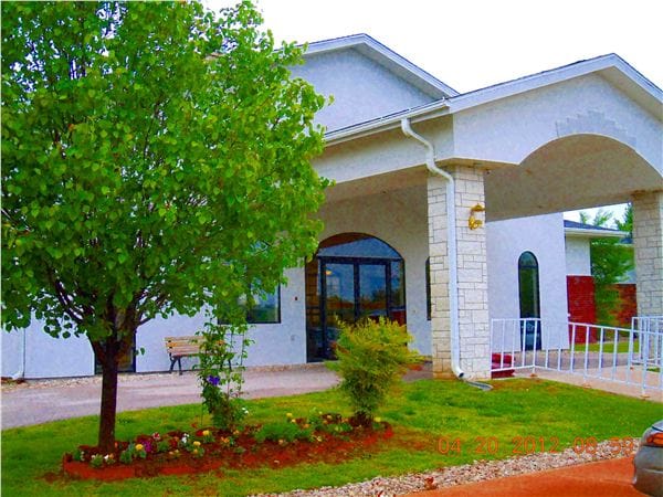 Exterior view of Maries Manor with garden