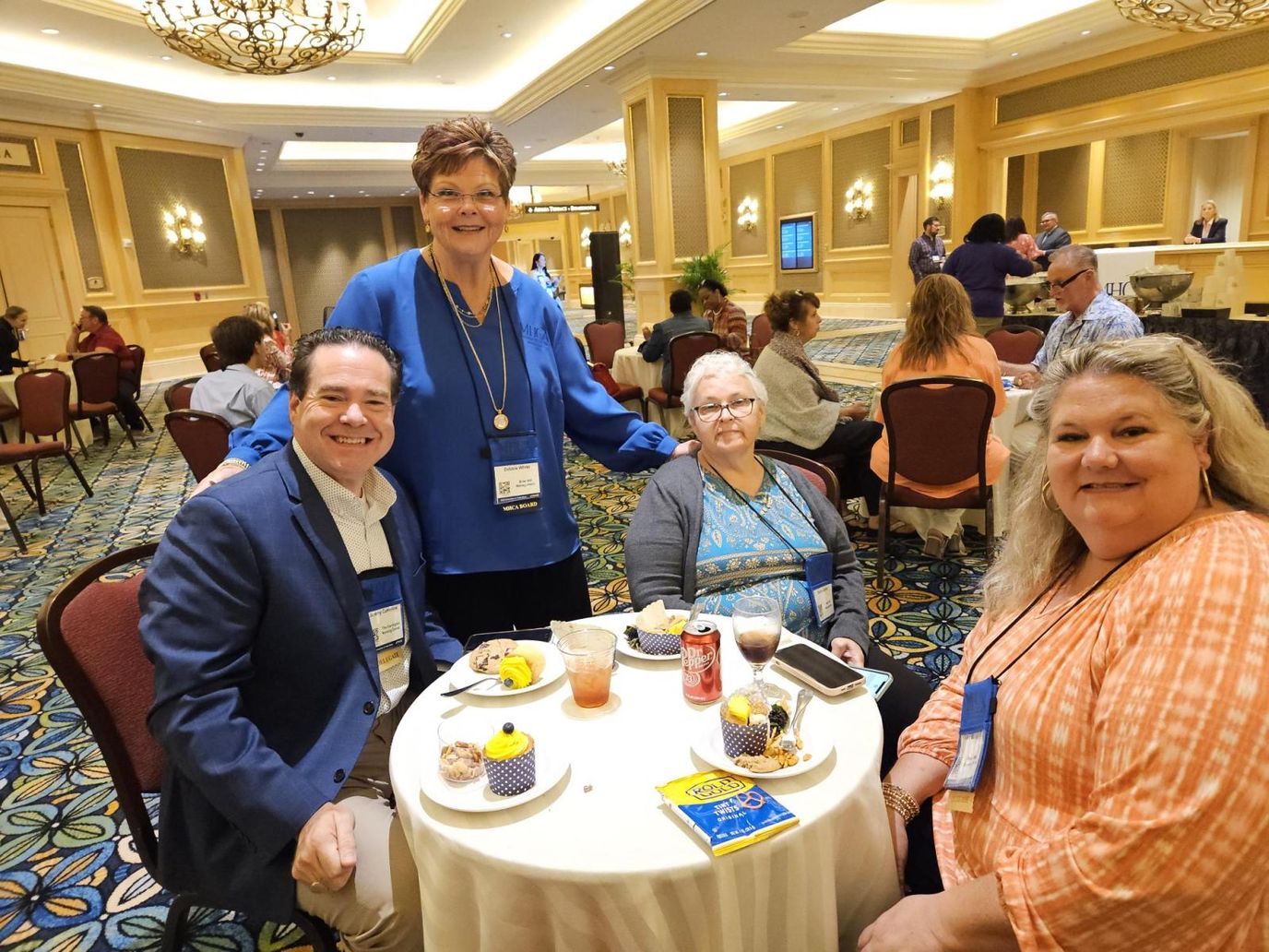 Residents and staff enjoying refreshments at a social event