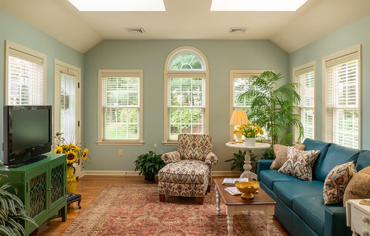 Bright and inviting common area with plants and seating