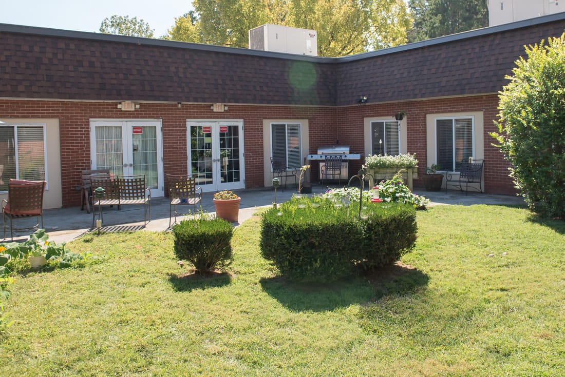 Outdoor patio area with seating and plants