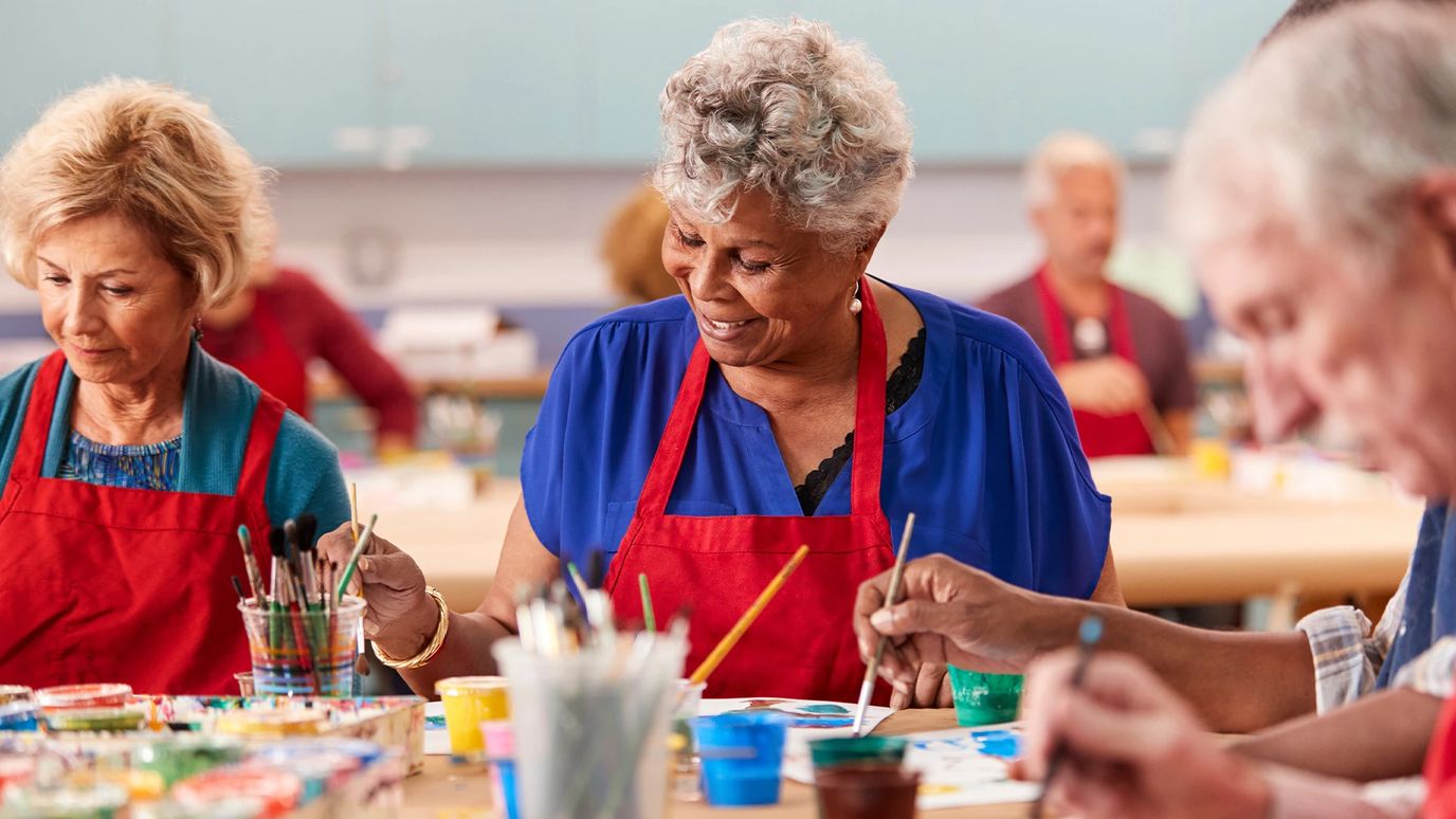 Residents engaged in a painting activity.