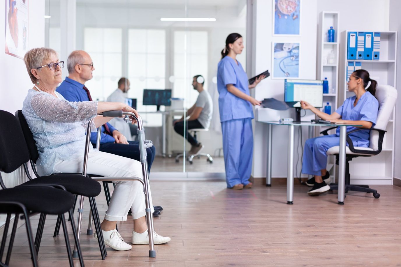 Residents and staff in a brightly lit common area