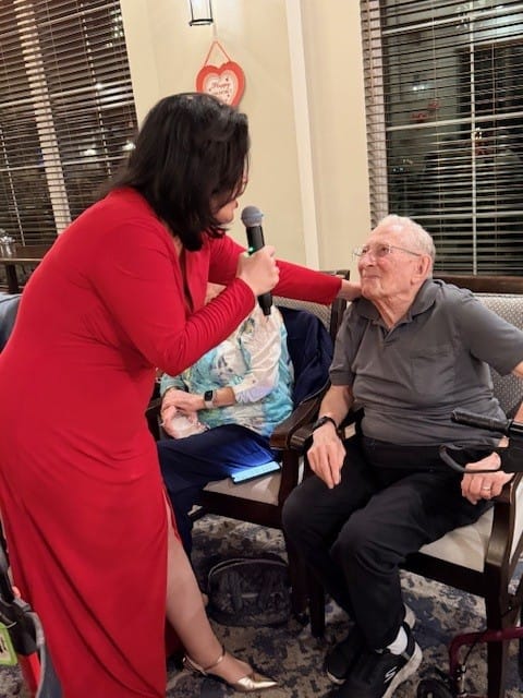 Staff member engaging with a resident in a common area