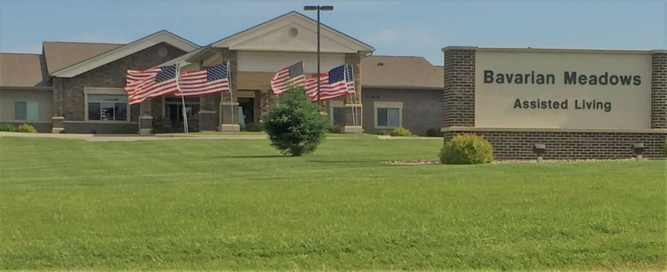 Exterior view of Bavarian Meadows with flags and lawn
