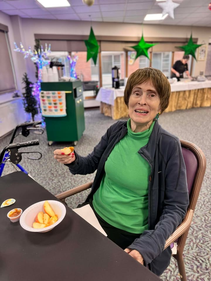 A resident enjoying a snack in a common area