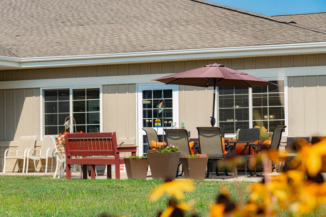 Outdoor seating area with tables and chairs