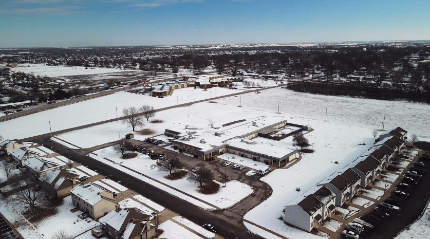 Aerial view of Meadowbrook Rehabilitation Hospital covered in snow