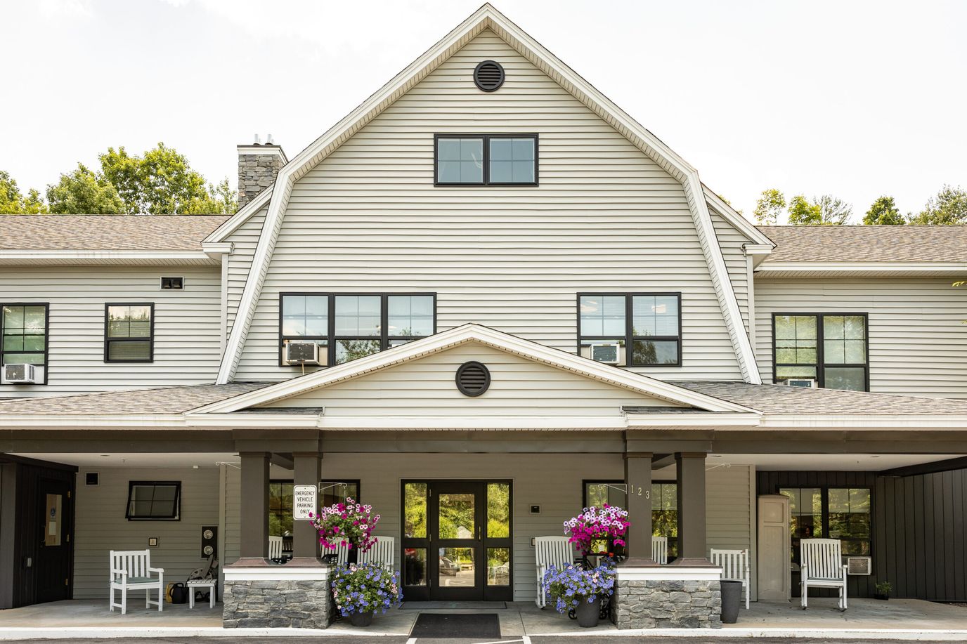 Exterior view of Inn at Village Square with floral decorations