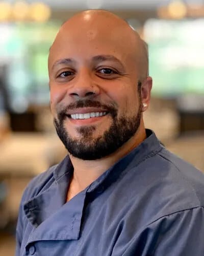Staff member smiling in a common area
