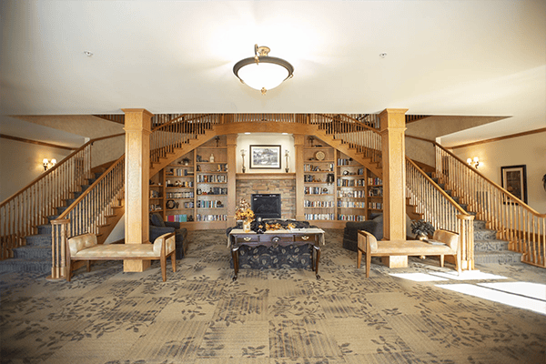 Bright lobby area with seating and a staircase