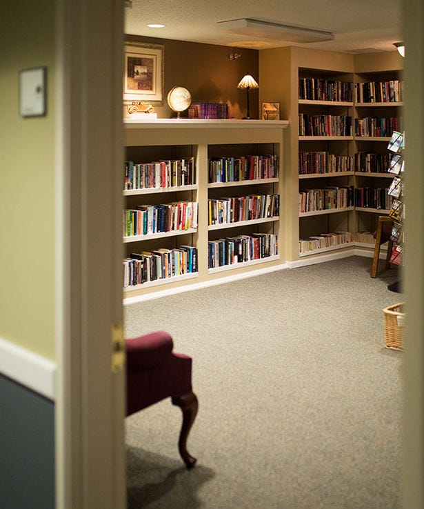 Cozy library with bookshelves and seating area