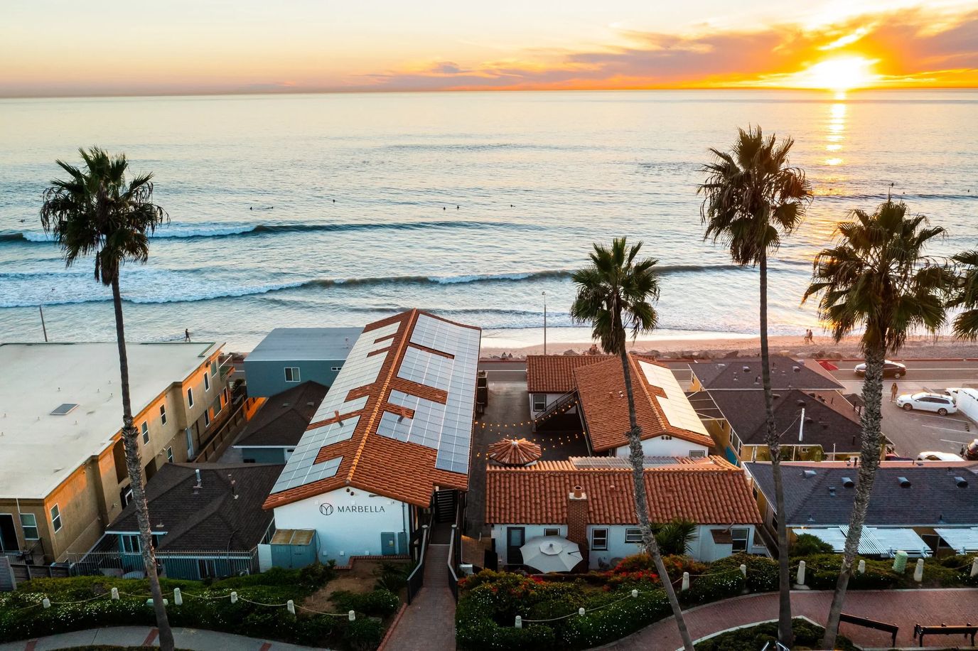 Aerial view of Marbella Anaheim with ocean sunset