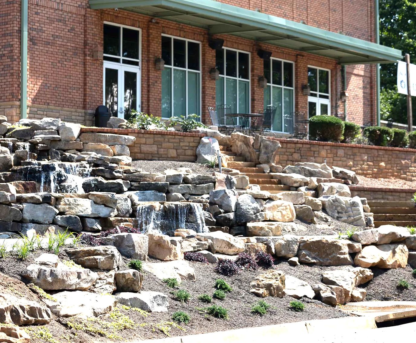 Outdoor water feature with steps leading to the entrance.