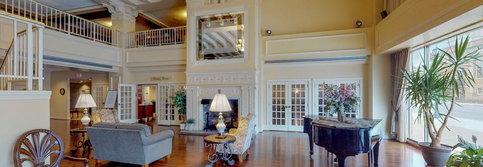 Interior view of a common area with a piano.