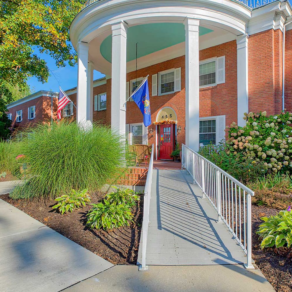 Entrance to Juniper Village at Meadville with landscaped path.