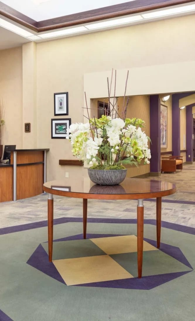 Bright and welcoming lobby area with flowers