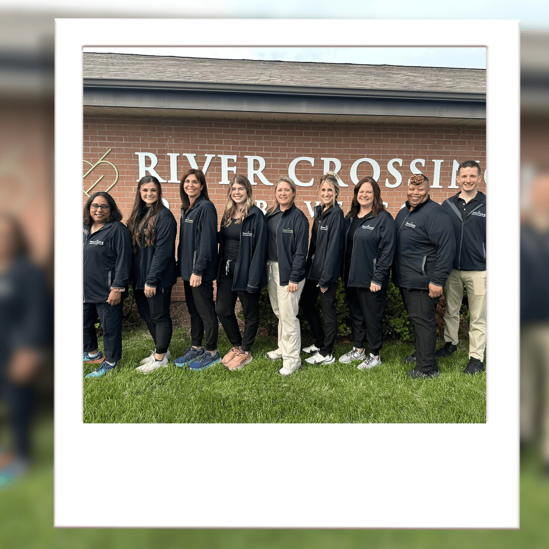 Staff members in front of the River Crossing facility