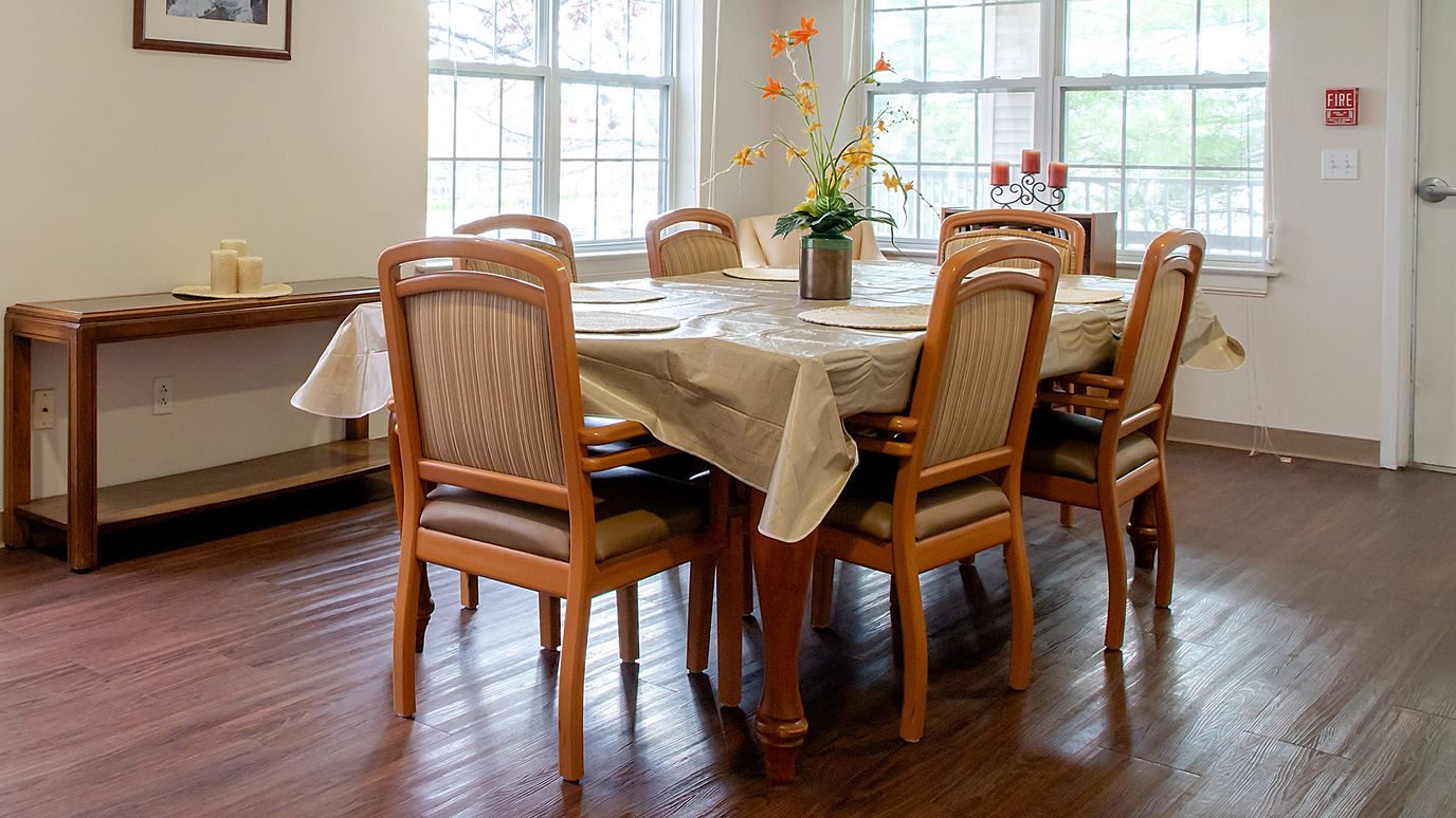 Dining room area with set table and chairs