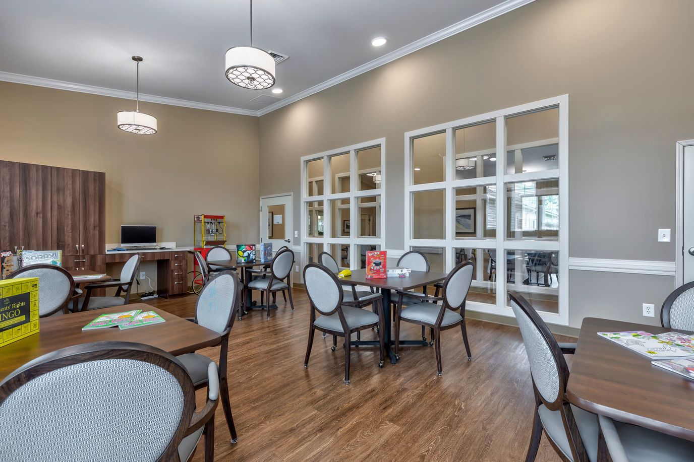 Bright and inviting common area with tables and chairs
