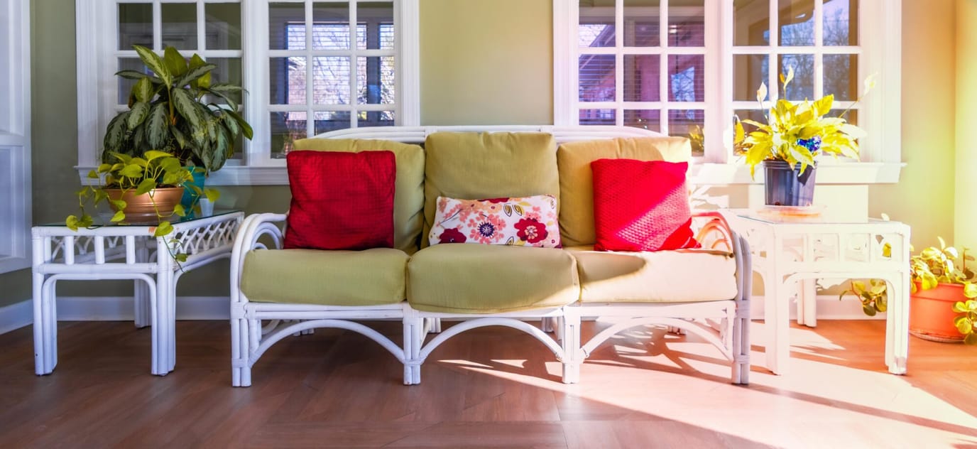 Cozy seating area with bright cushions and plants