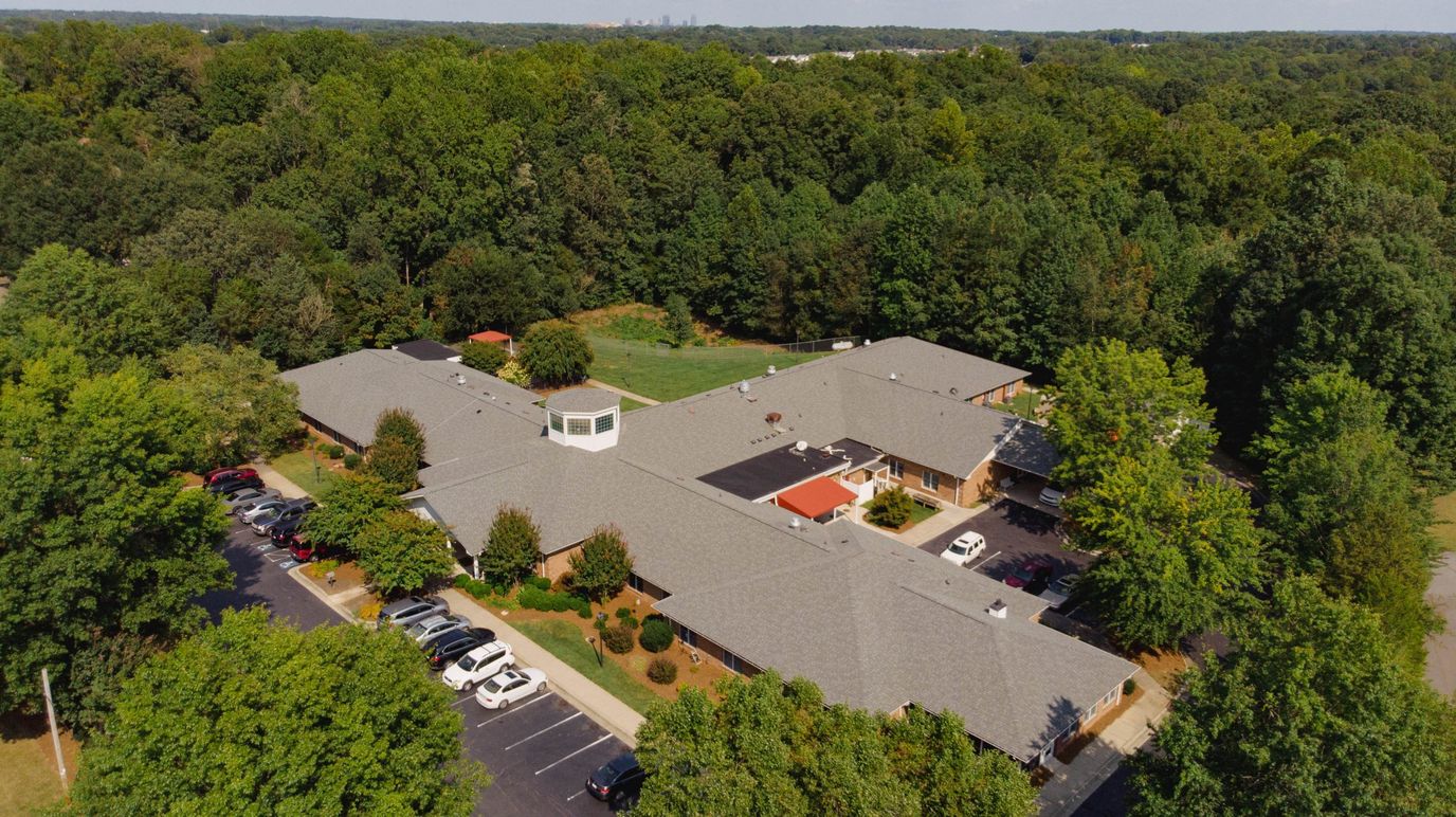 Aerial view of Southfork's facility surrounded by trees