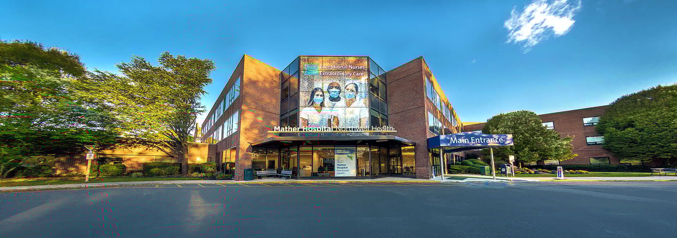 Exterior view of John T Mather Memorial Hospital with entrance