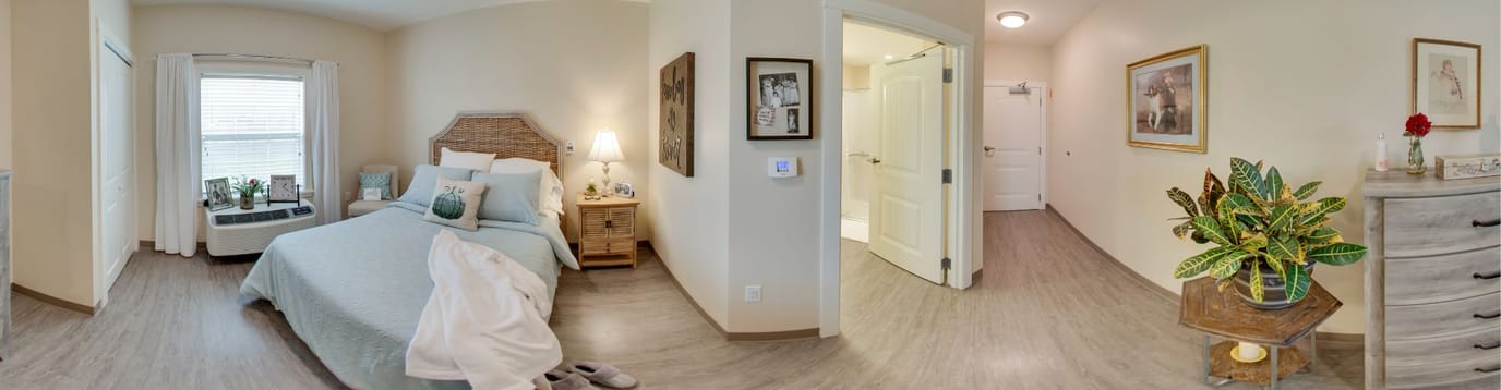 A cozy private resident room with a bed and decor