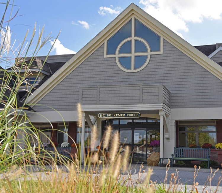 Exterior view of the facility building with landscaping