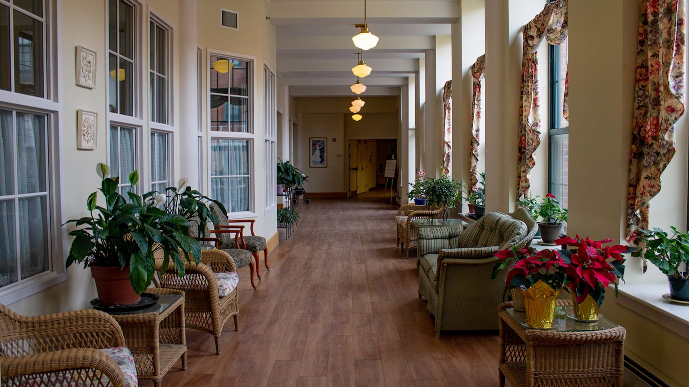 Bright hallway with plants and seating