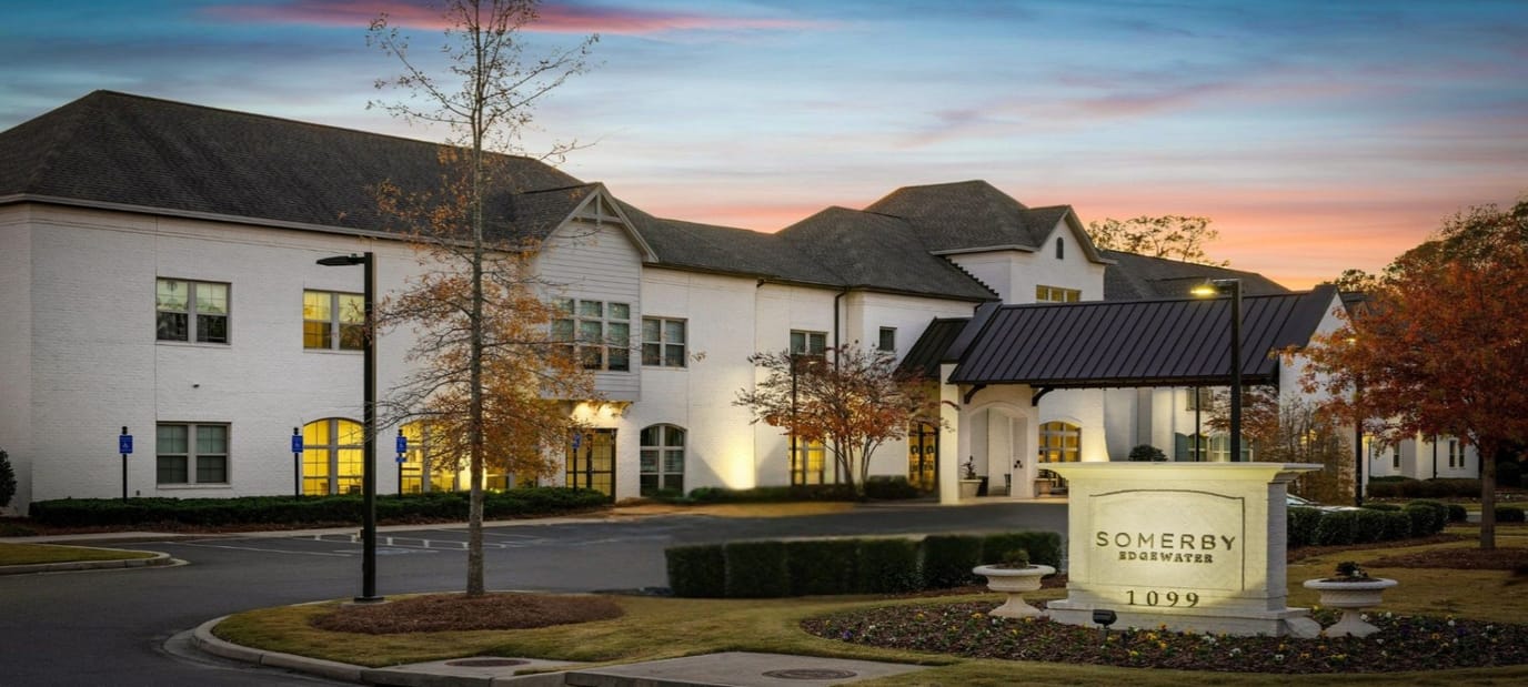 Exterior view of Somerby Edgewater facility at dusk