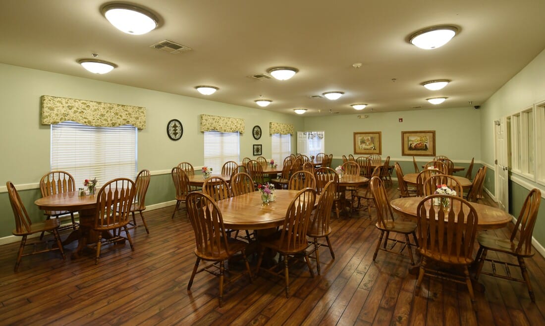 Dining area with wooden tables and chairs