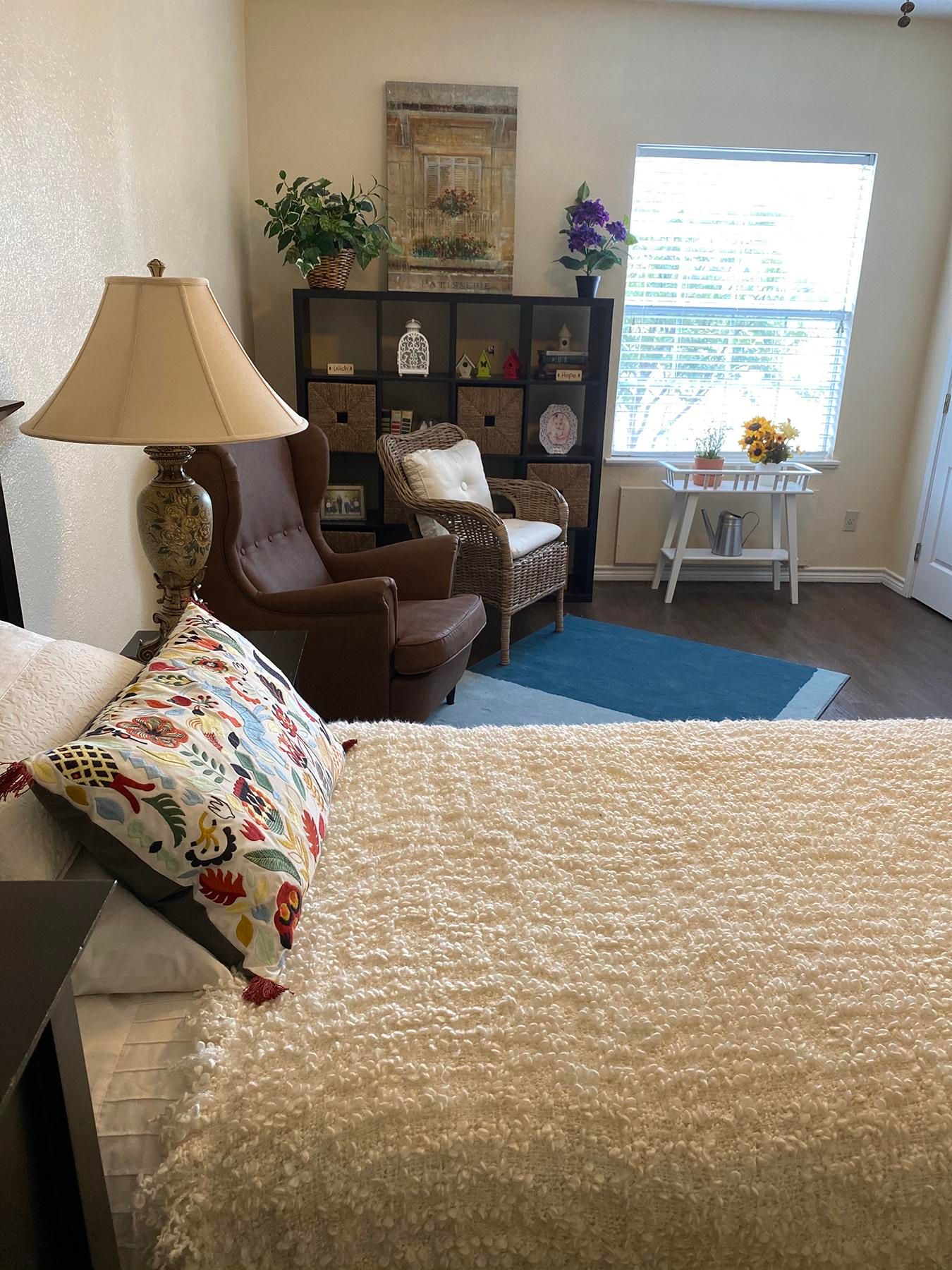 Cozy interior of a resident's room with a chair and decor