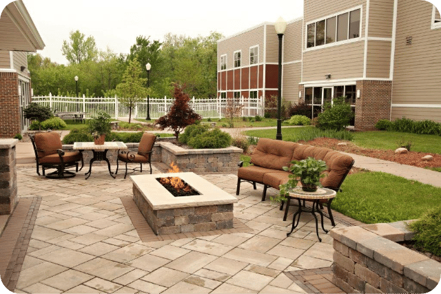 Outdoor seating area with firepit at a nursing home