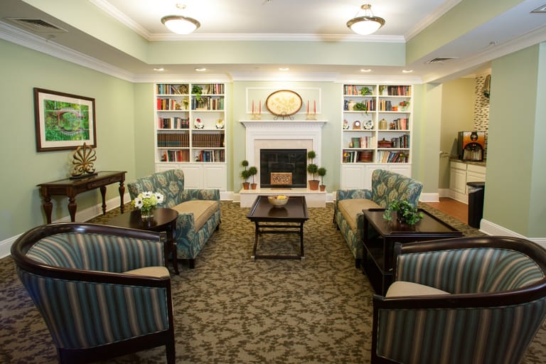 Cozy common area with seating and bookshelves