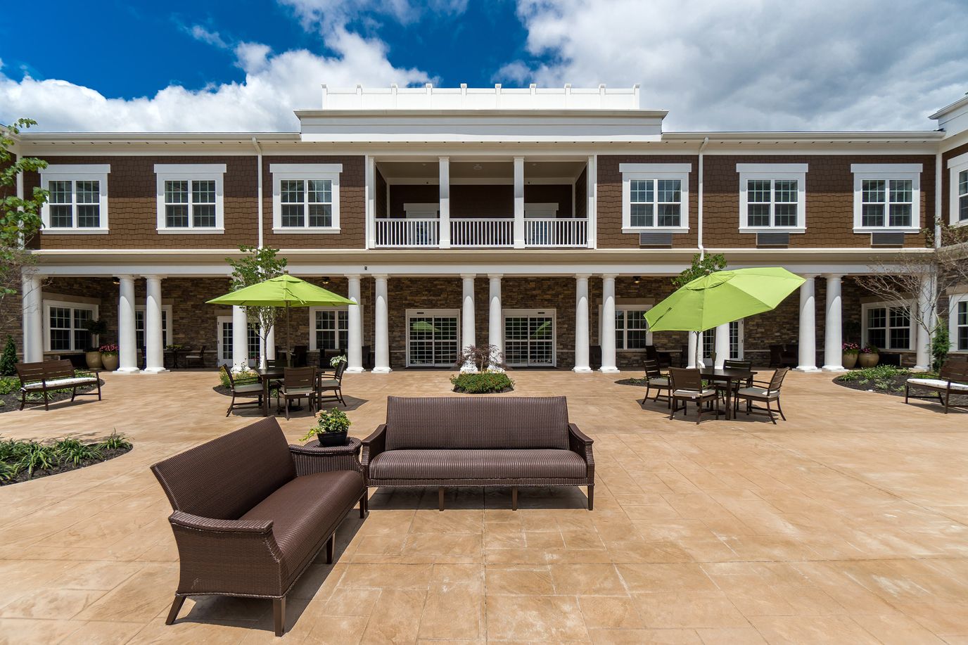 Outdoor courtyard with seating and greenery