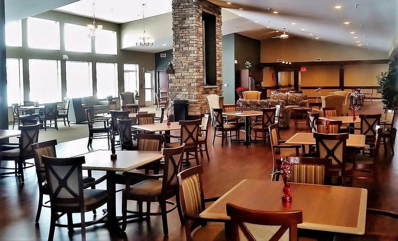 Bright and spacious dining area with tables and seating