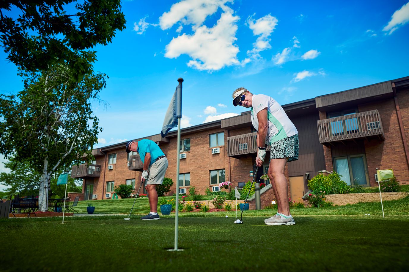 Residents enjoying a game of putting outside