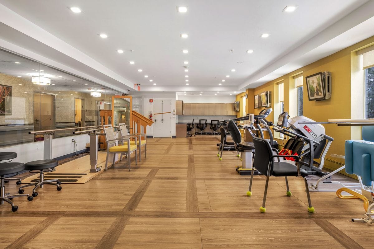 Interior view of a rehabilitation therapy room with equipment