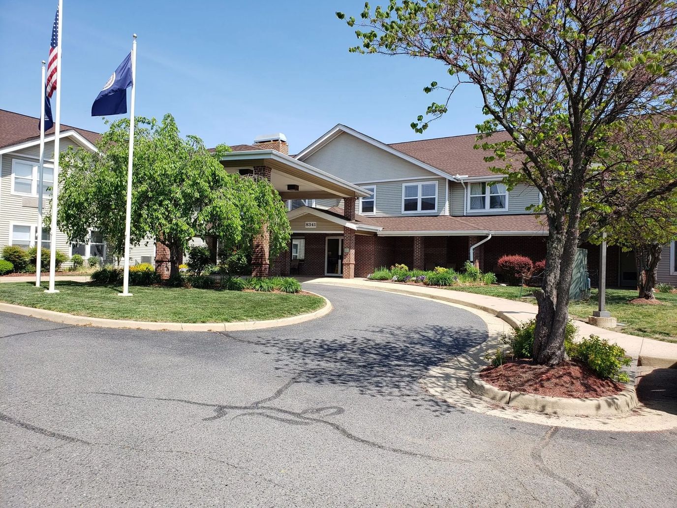 Entrance of Paramount Senior Living with landscaped surroundings