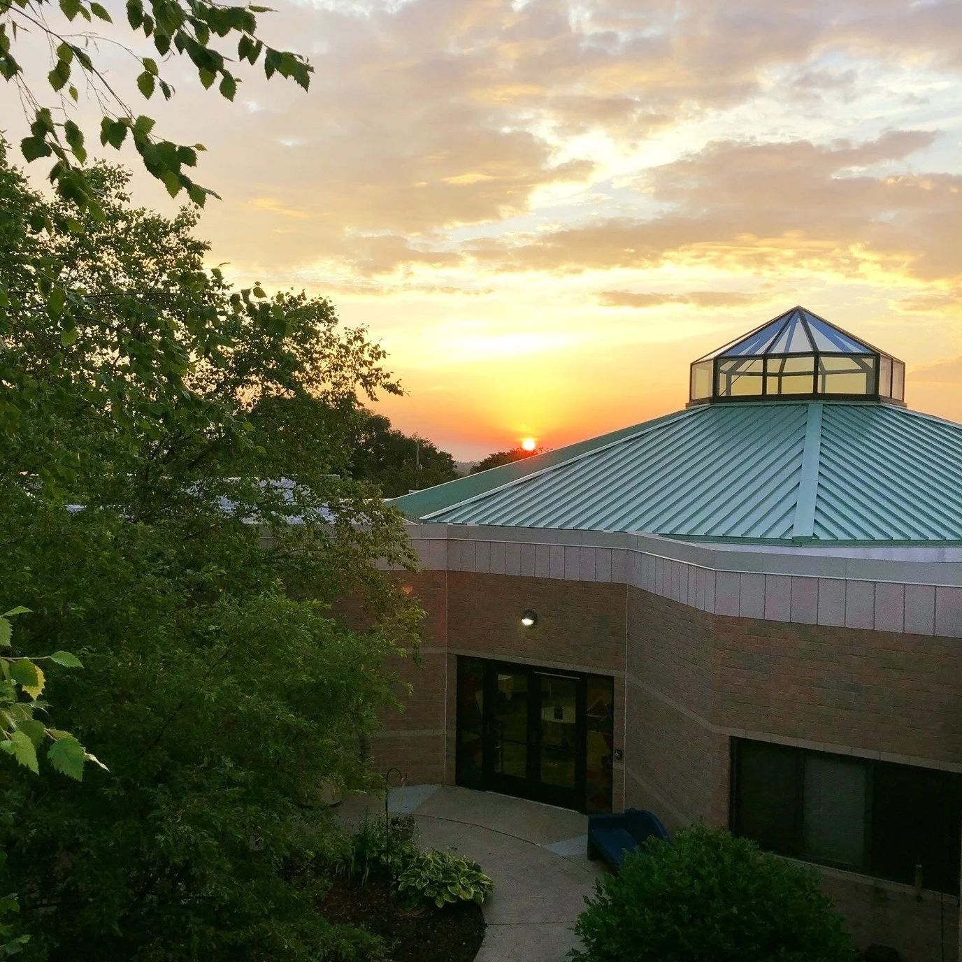 Sunset over the facility's architectural roof
