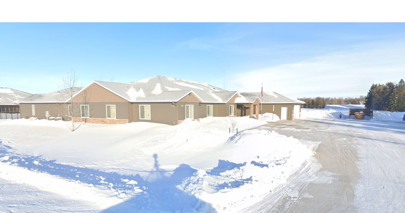 Exterior view of Kinder Care Assisted Living Homes in winter