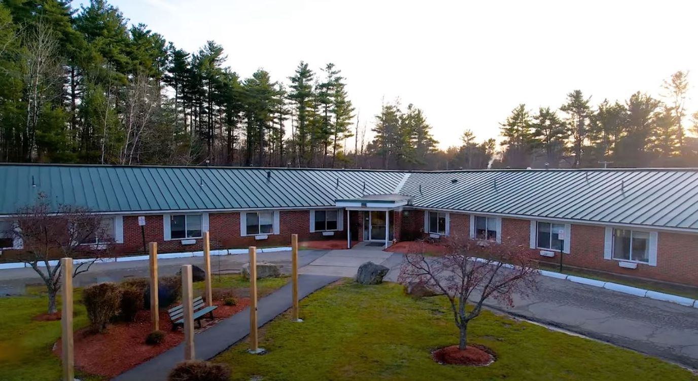 Aerial view of the assisted living facility surrounded by trees