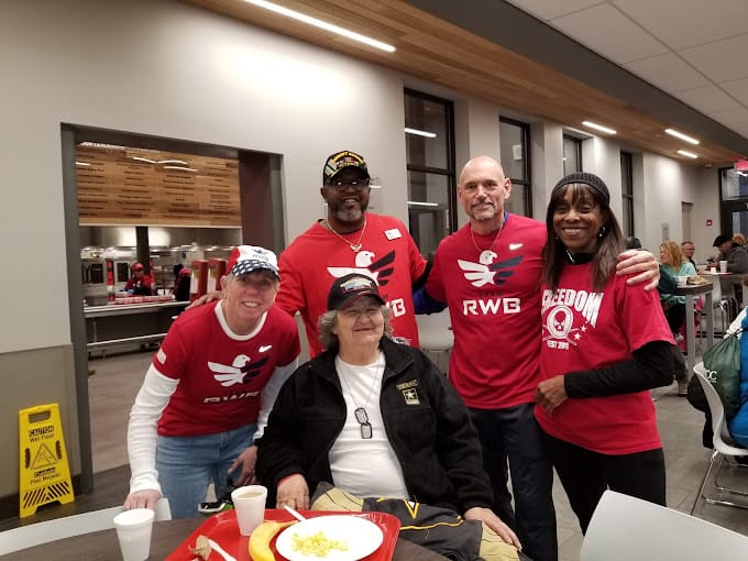 Group of residents and staff celebrating together