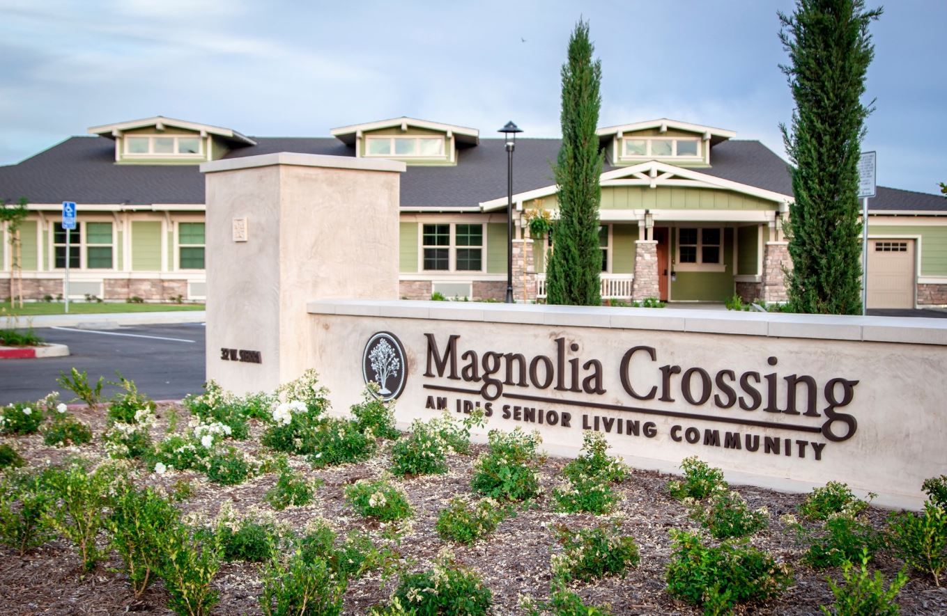 Exterior view of Magnolia Crossing assisted living facility sign