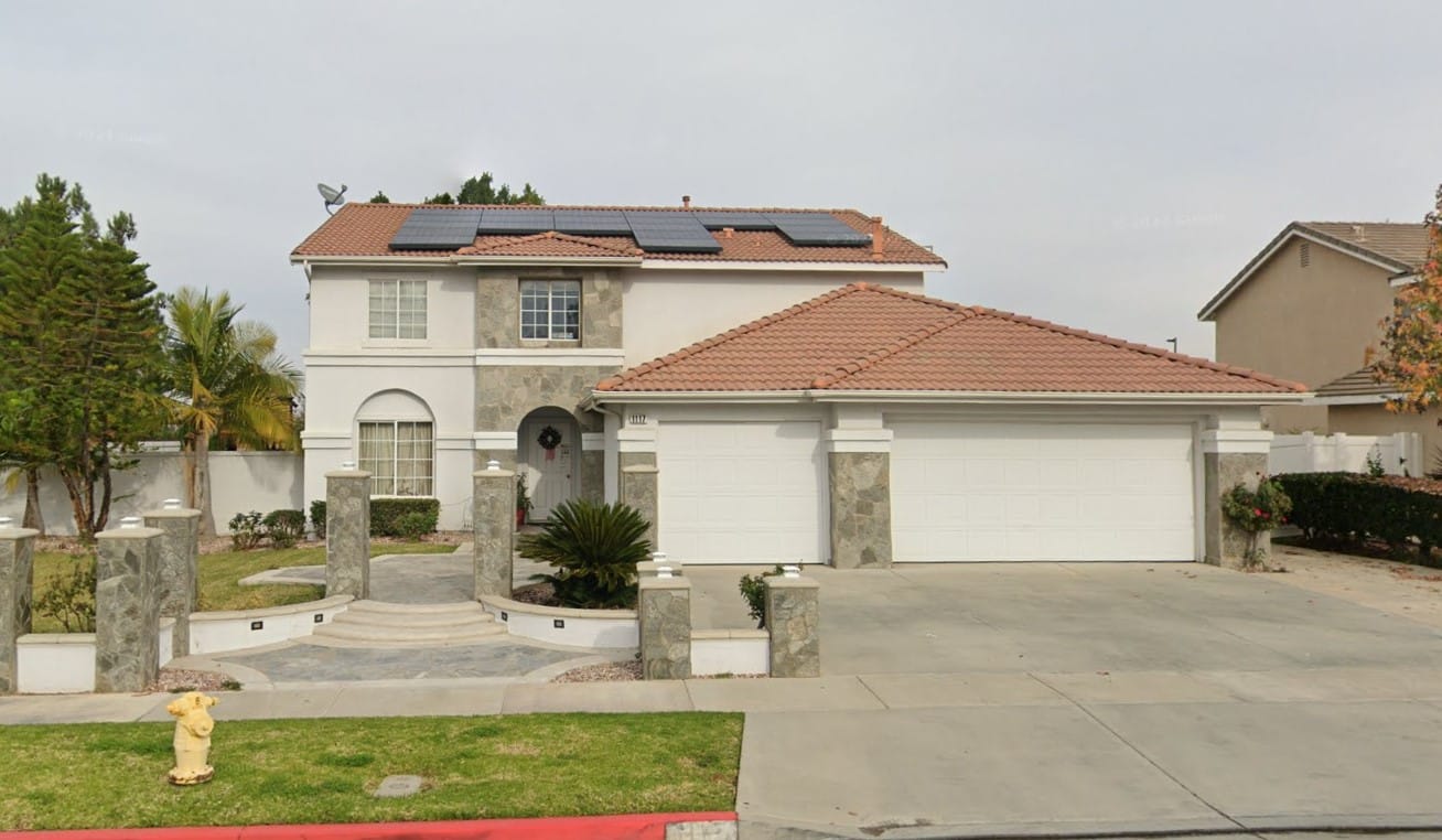 Exterior view of a residential building with solar panels