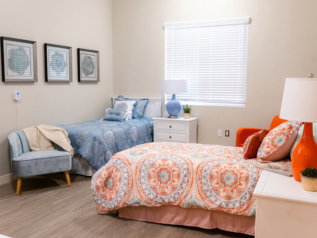 Cozy interior room with two beds and decorative bedding